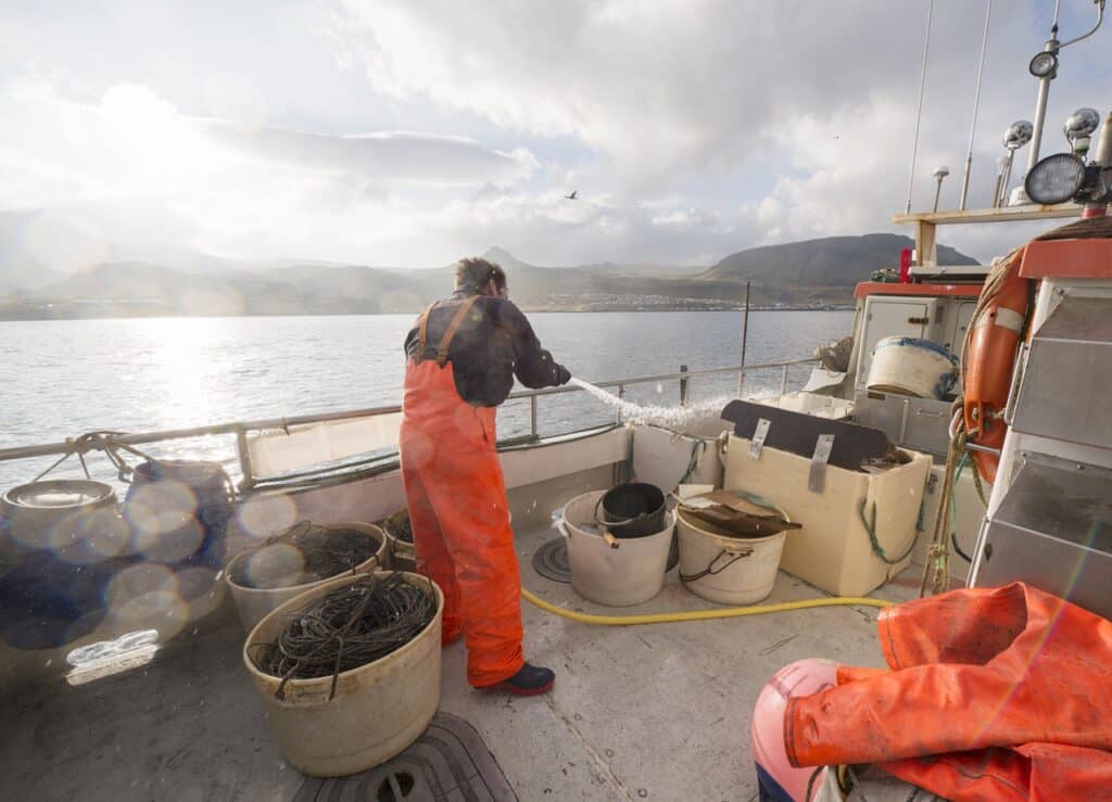 fisherman hosing down fishing boat 2023 11 27 05 35 16 utc